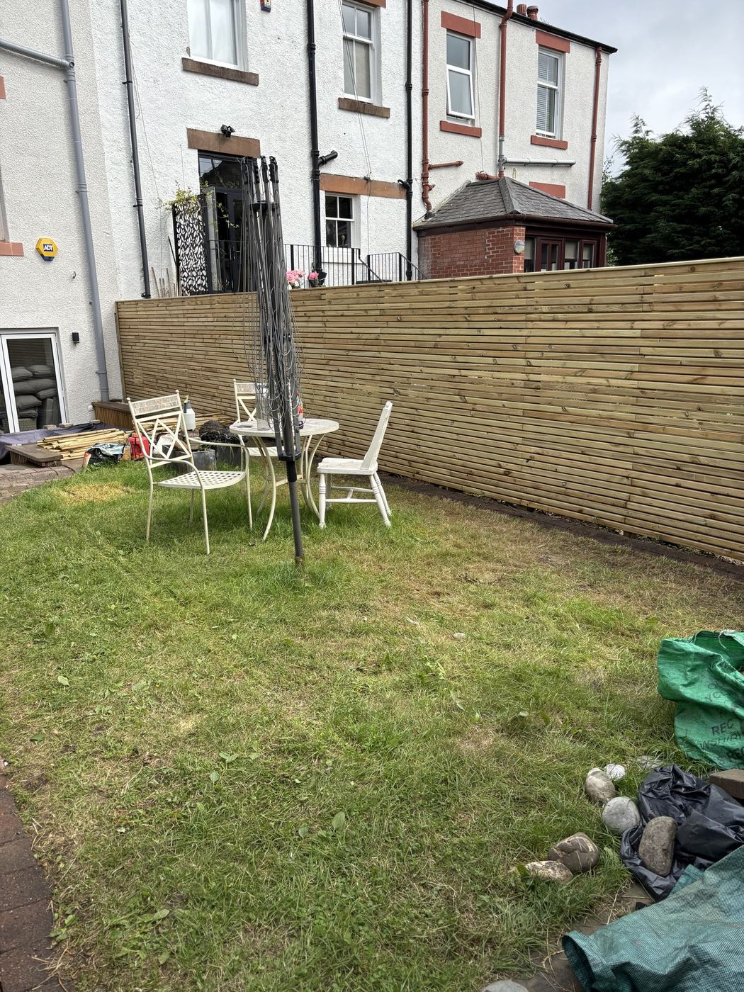 Slatted fence running along the patio