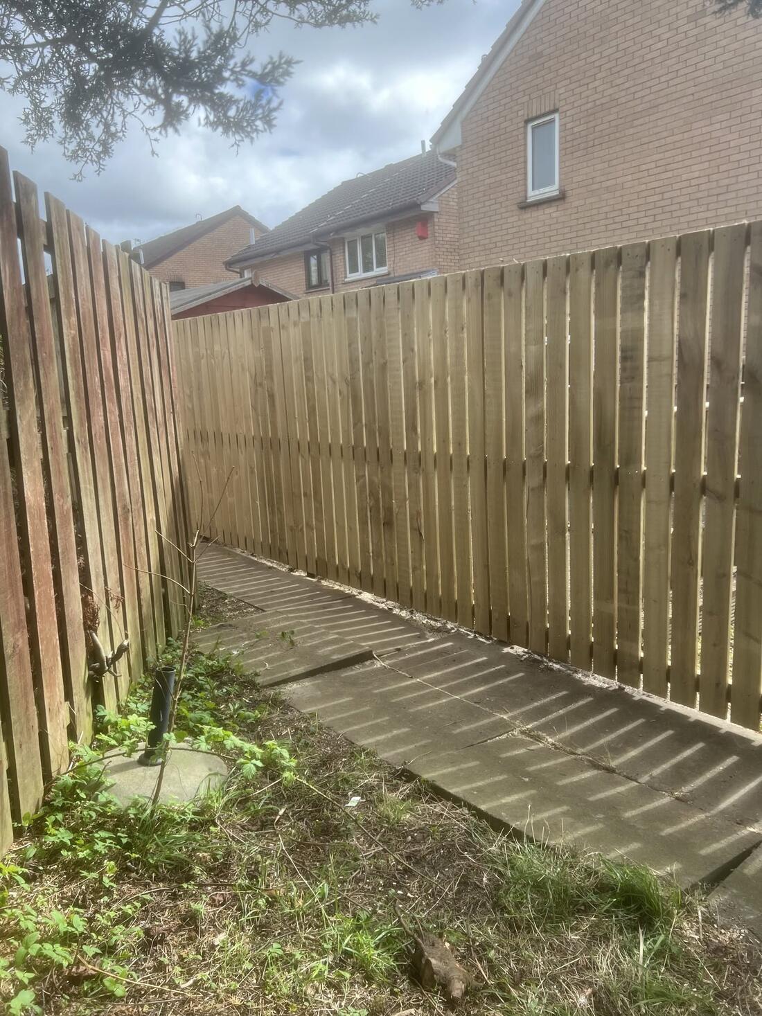 Vertical board fence, corner garden